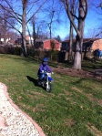 Helen rides her TT-R 50 in her yard