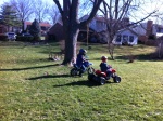 Henry rides a Powerwheels KFX quad and Helen rides her TT-R 50 in the back yard